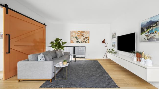 A barn door separates formal lounge in the centre of the house.