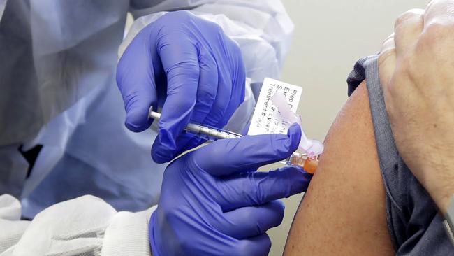 A patient receives a shot in a clinical trial of a genuine potential vaccine for COVID-19. Picture: AP.