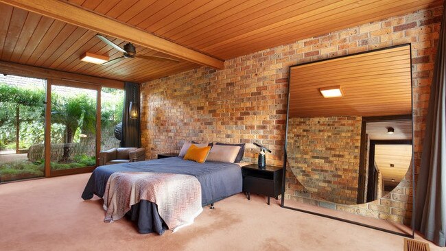 The spacious main bedroom also opens out to the pool.