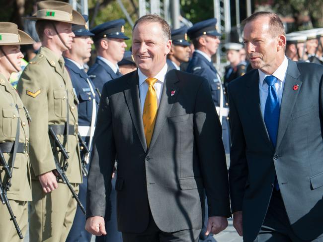 Anzac visit ... John Key and Tony Abbott inspect the guard of honour during a dedication to the Australia ANZAC memorial at Pukeahu National War Memorial Park in Wellington. Picture: AFP