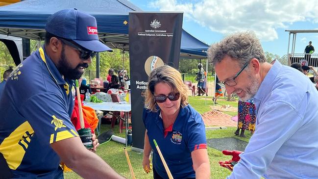 East Arnhem Regional Council chief executive Dale Keehne adding his handprint to the council's Midawarr banner with Council staff in Nhulunbuy. Picture: Facebook