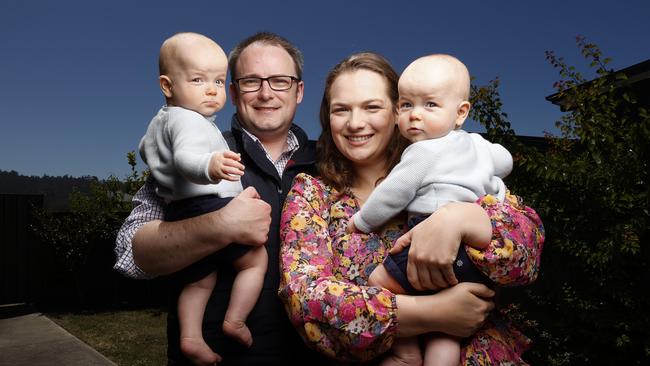 Hugh McCracken and Amy Burnell of Kingston with 8-month-old twin boys William and Angus McCracken. Picture: ZAK SIMMONDS