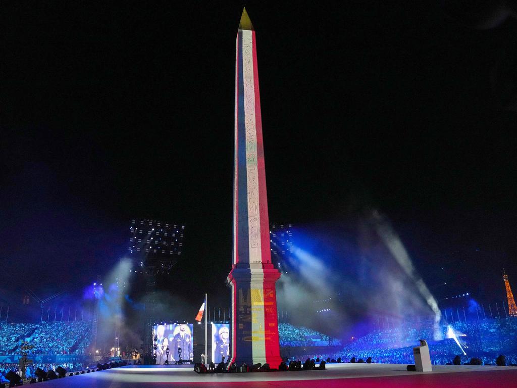 The Luxor Obelisk bears the colours of the flag in spectacular fashion. Picture: Thibault Camus/POOL/AFP