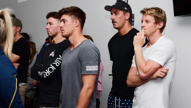 Crows players Luke Brown, Riley Knight, Rory Sloane and Taylor Walker watch from the back of the room as new coach Matthew Nicks speaks to the media. Picture: Mark Brake/Getty Images.