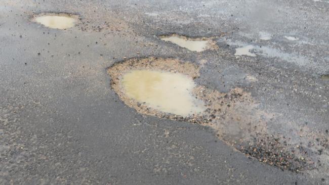 Among the worst of the potholes that have developed on the Palmerston Highway between the Millaa Millaa township and the Falls Teahouse in the past three weeks. David Anthony photo