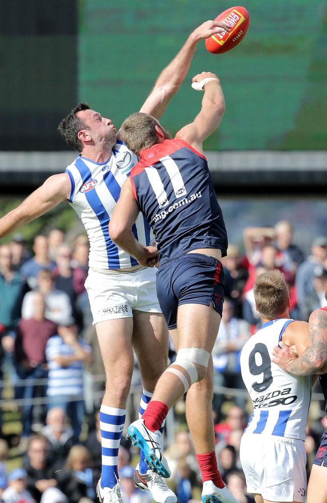 Todd Goldstein and Max Gawn compete at a centre bounce. Picture: Luke Bowden