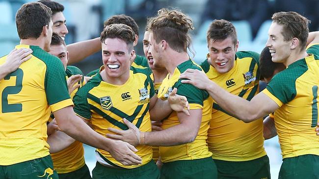 Teammates celebrate a try by Jaydn Su'a of Australia during the international Junior Test match between the Australian Junior Kangaroos and the New Zealand Junior Kiwis.