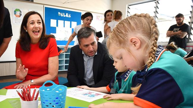 Queensland Premier Annastacia Palaszczuk (left) and Linus Power (centre), State Member for Logan are seen in the Prep classroom at Yarrabilba State School. (AAP Image/Darren England)