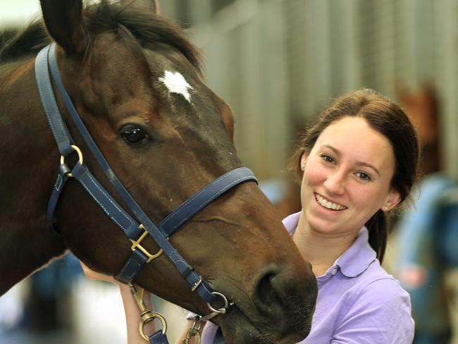 Jockey Katelyn Mallyon says there is plenty of work in the horse racing industry and more girls are being given a go. Katelyn with racing horse Jonny at the Caulfield Racecourse stables Picture: Janine Eastgate