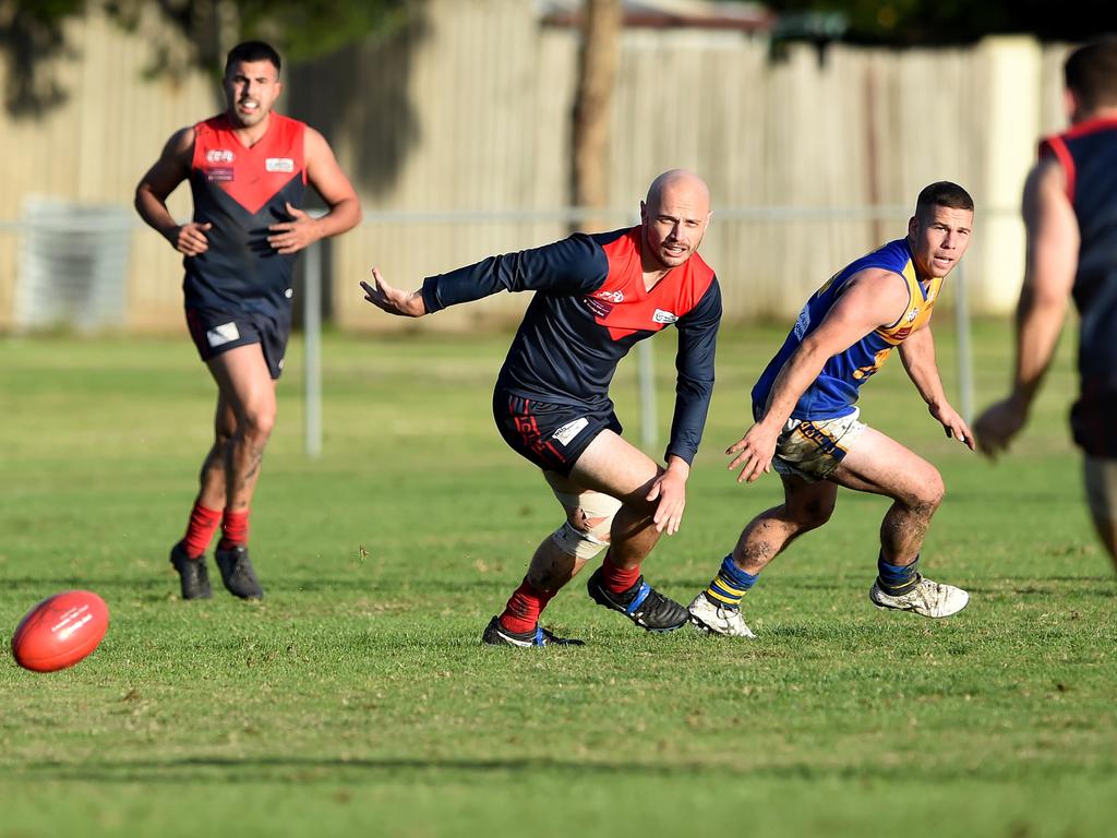 Essendon District: Tullamarine’s Adam Bartrop and Stephen Tieppo of Taylors Lakes over run the ball. Picture: Steve Tanner