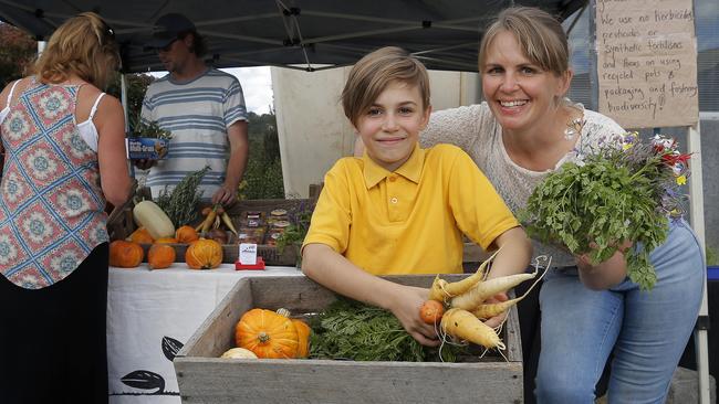 SUN TAS: Elsie Deakin, 9 with mother, Paulette Whitney who grows vegetables and unusual edible plants with her partner, Matthew Deakin under the business name, Provenance Growers. BYLINE: LUKE BOWDEN