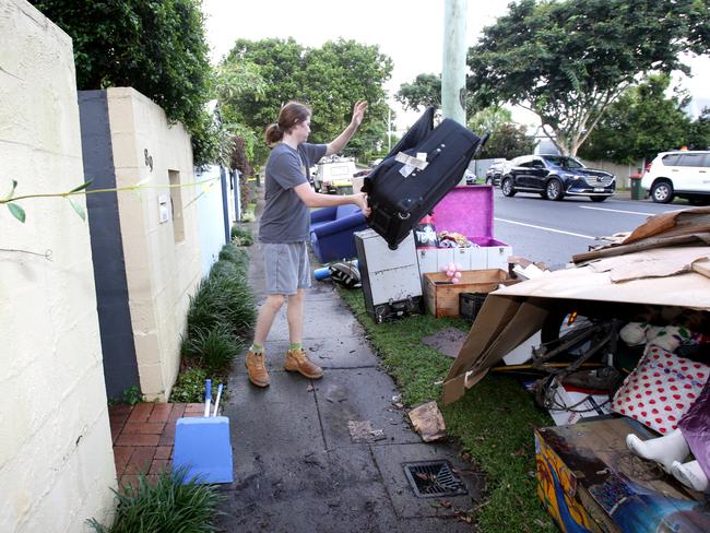 Kobey Styles cleaning out her flooded house in Paddington. Picture: Steve Pohlner