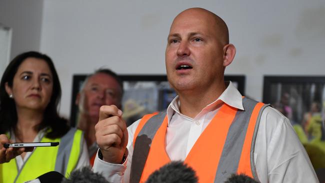 Queensland Premier Annastacia Palaszczuk (left) watches Treasurer Curtis Pitt speaking at a press conference during a visit to Cairns yesterday. Picture: AAP/Dan Peled