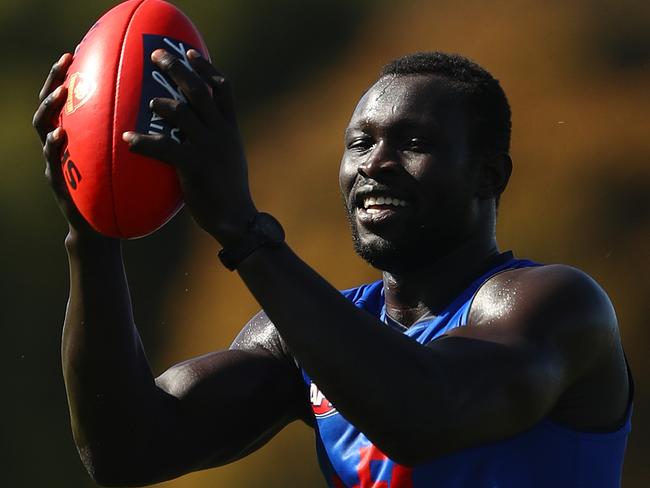 MELBOURNE, AUSTRALIA - FEBRUARY 17: Majak Daw joins the Melbourne Demons for their AFL training session at Casey Fields on February 17, 2021 in Melbourne, Australia. (Photo by Robert Cianflone/Getty Images)