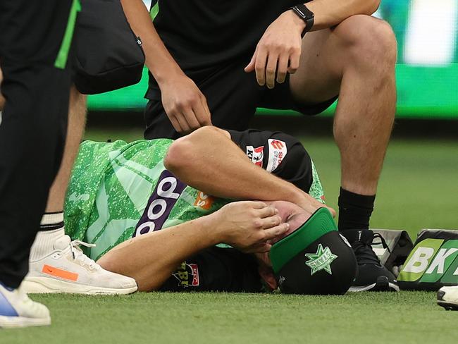 PERTH, AUSTRALIA - DECEMBER 15: Hilton Cartwright of the Stars is attended to by medical staff after injuring his neck while fielding during the BBL match between Perth Scorchers and Melbourne Stars at Optus Stadium, on December 15, 2024, in Perth, Australia. (Photo by Paul Kane/Getty Images)