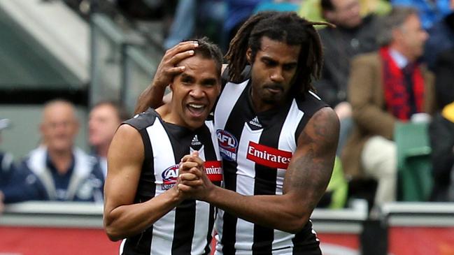 Andrew Krakouer with former Collingwood teammate Heritier Lumumba in the 2011 grand final.