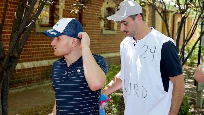 Adelaide Crows players Rory Laird and his caddy, skipper Taylor Walker. Picture: Calum Robertson