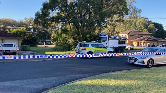 Police have cordoned off Mahogany St at Raceview following a house fire and disturbance early Friday morning in which a man was seriously injured.