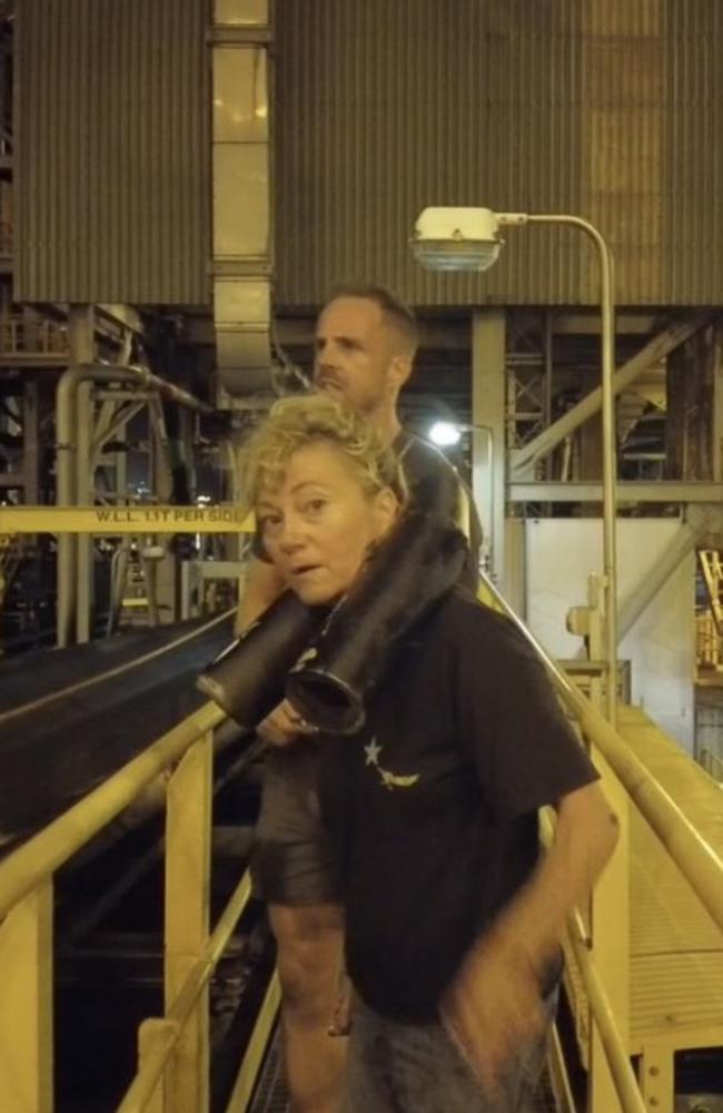 Kyle Magee (behind) and Juliet Lamont allegedly chained themselves to the conveyor belts to protest inadequate emission targets as a part of Frontline Action on Coal's movement, October 25, 2021. Picture: Contributed