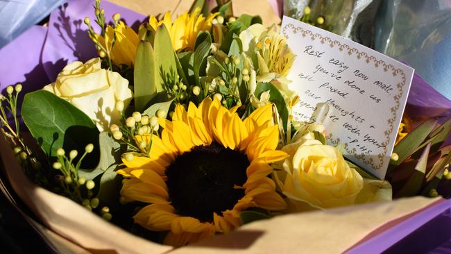 Flowers are laid in memory of Brett Forte outside the Toowoomba police station. Picture: AAP/Sarah Motherwell