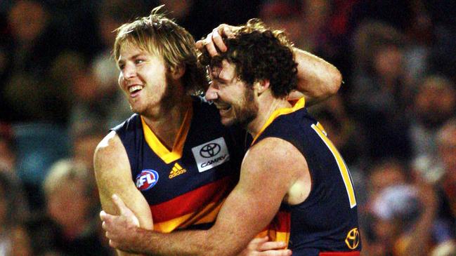 Trent Hentschel celebrates with Ken McGregor in the Crows’ win over Essendon.