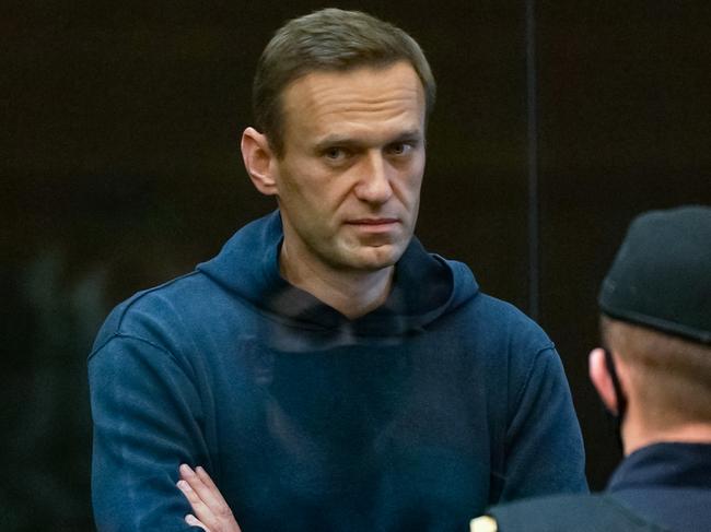 Russian opposition leader Alexei NavalnY stands inside a glass cell during a court hearing in Moscow in 2021. Picture: AFP