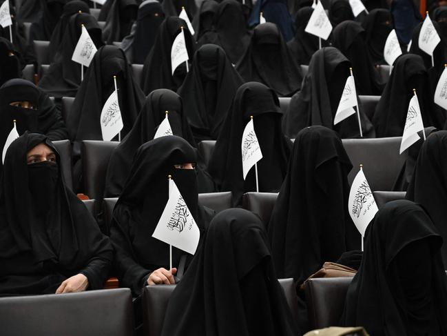 Afghan women wearing full face veils sat in rows at a Kabul university lecture theatre on Saturday, pledging commitment to the Taliban's hardline policies on segregation. Picture: AFP