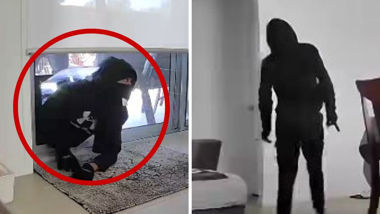 Shock footage of masked intruder breaking into Qld home through dog door