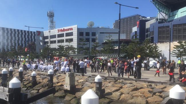 Workers and patrons evacuated after the Docklands fire. Picture: William Zwar.