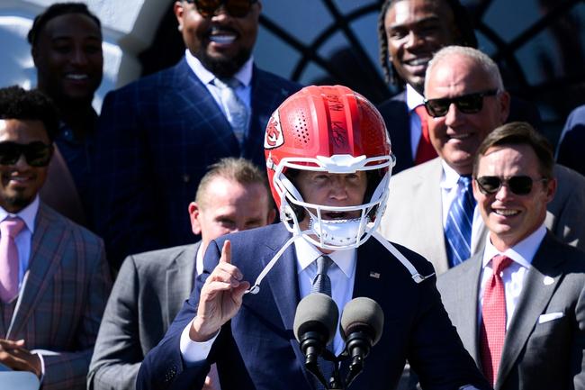 US President Joe Biden wears a Kansas City Chiefs helmet while speaking during a celebration for the Kansas City Chiefs, 2024 Super Bowl champions, on the South Lawn of the White House in Washington, DC, on May 31, 2024.