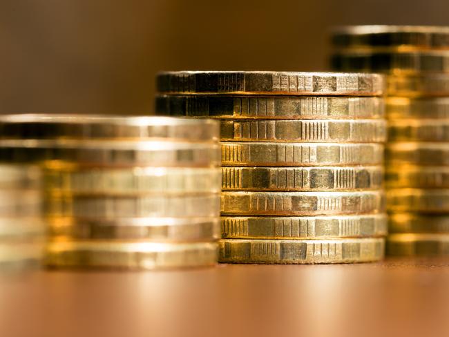 Stacks of gold coins of varying heights, Australian money generic