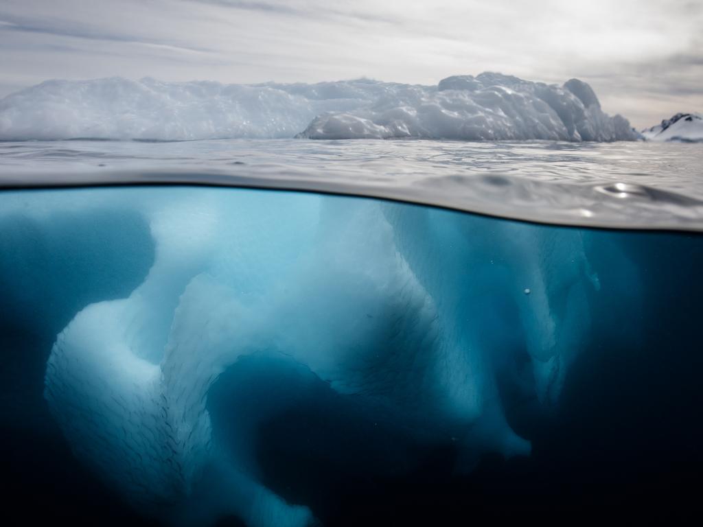 An underwater photo of an iceberg in the Southern Ocean offshore the Antarctic Peninsula.