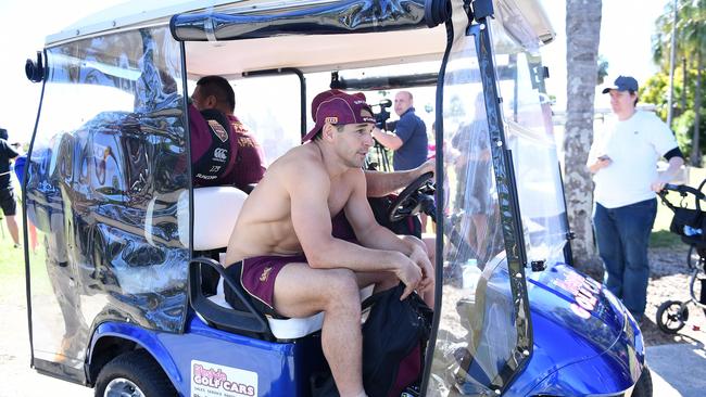 Billy Slater is driven away for treatment after rolling his ankle during a Queensland State of Origin team training session on Sunday.