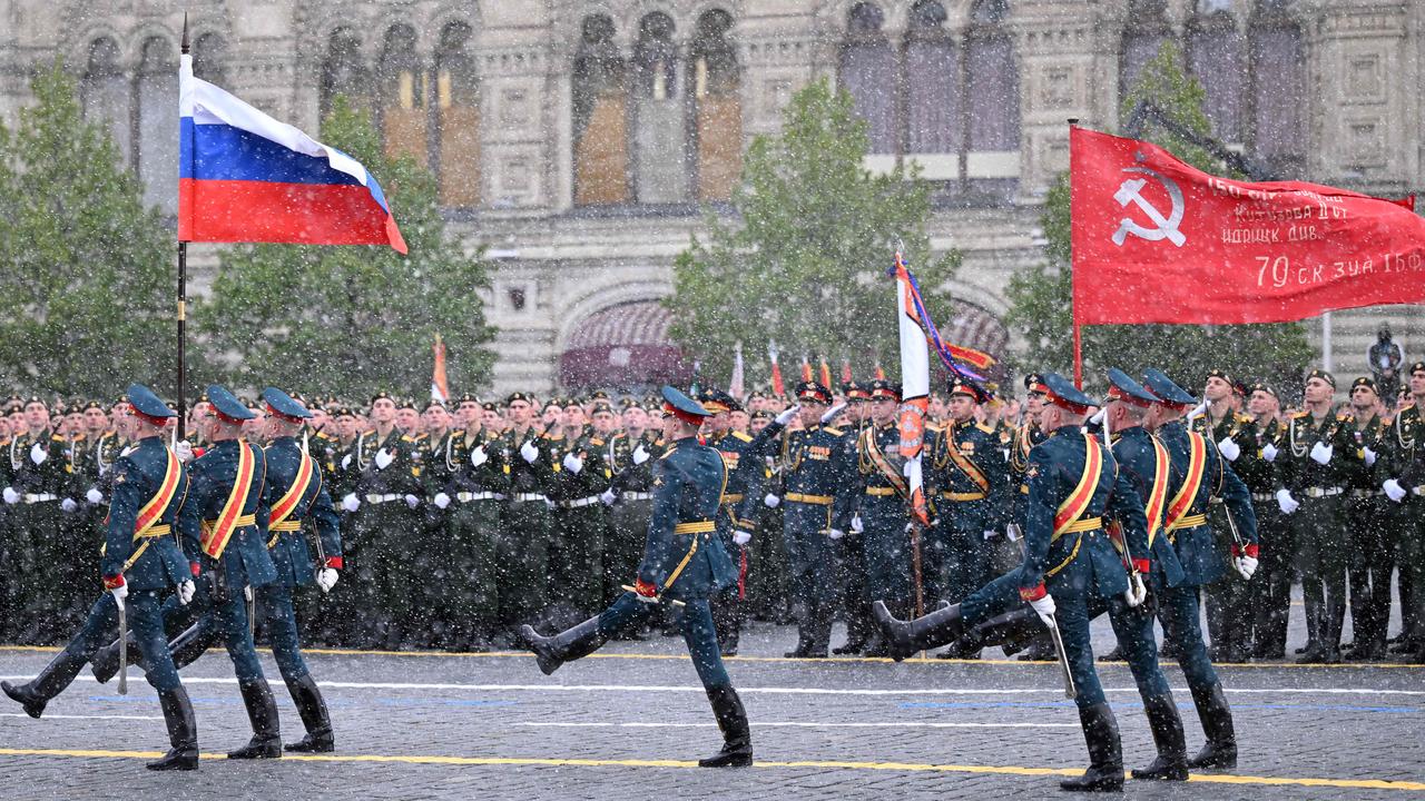 Russian honour guard soldiers carrying the Russian national flag and a red flag replica of the Victory banner, march on Red Square during the Victory Day military parade in Moscow on May 9, 2024 as Russia celebrated the 79th anniversary of the victory over Nazi Germany in World War II. Picture: Natalia Kolesnikova/AFP