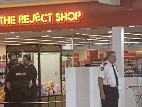 Police at Munno Para Shopping Centre, where a man has been arrested after another man was stabbed. Picture: 7NEWS