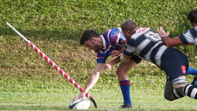 Bull's Duane Erasmus gets pushed over the sideline while scoring a try in the FNQ Rugby match between the Barron Trinity Bulls and Cairns Brothers, held at Stan Williams Park, Manunda. PICTURE: BRENDAN RADKE