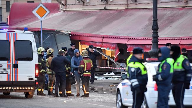 Russian police investigators inspect the damaged 'Street bar' cafe in a blast in Saint Petersburg. Picture: AFP.