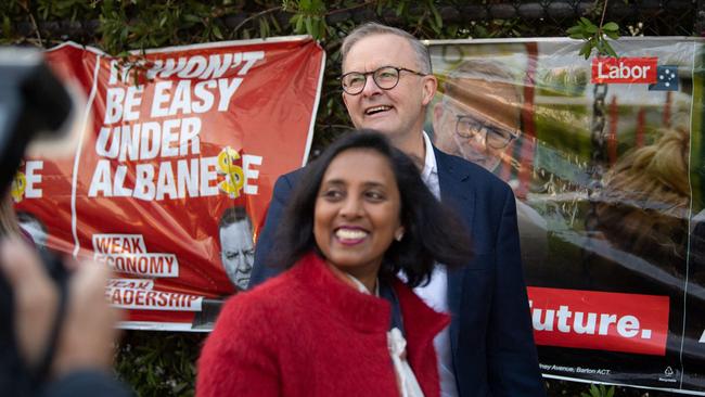 Anthony Albanese and Michelle Ananda-Rajah arrive at a polling station.