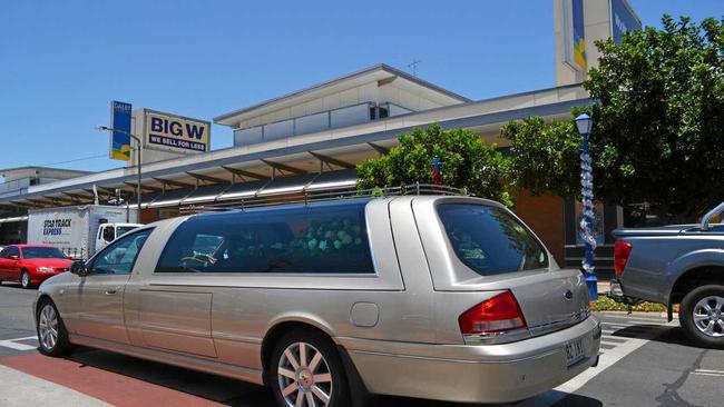 FAREWELL KEV: The cortege drove down Cunningham street in Dalby where Kev's menswear store used to lie. Picture: Meg Ganon