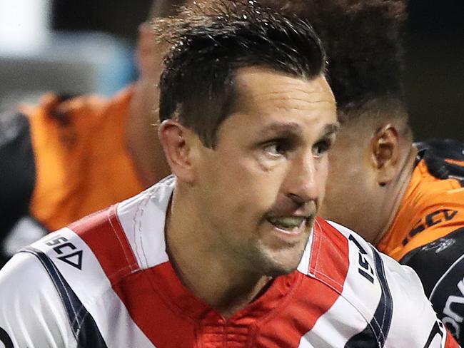 Roosters Mitchell Pearce on the way to scoring his first try during the Sydney Roosters v Wests Tigers rugby league game at Campbelltown Stadium, Sydney. Picture: Brett Costello