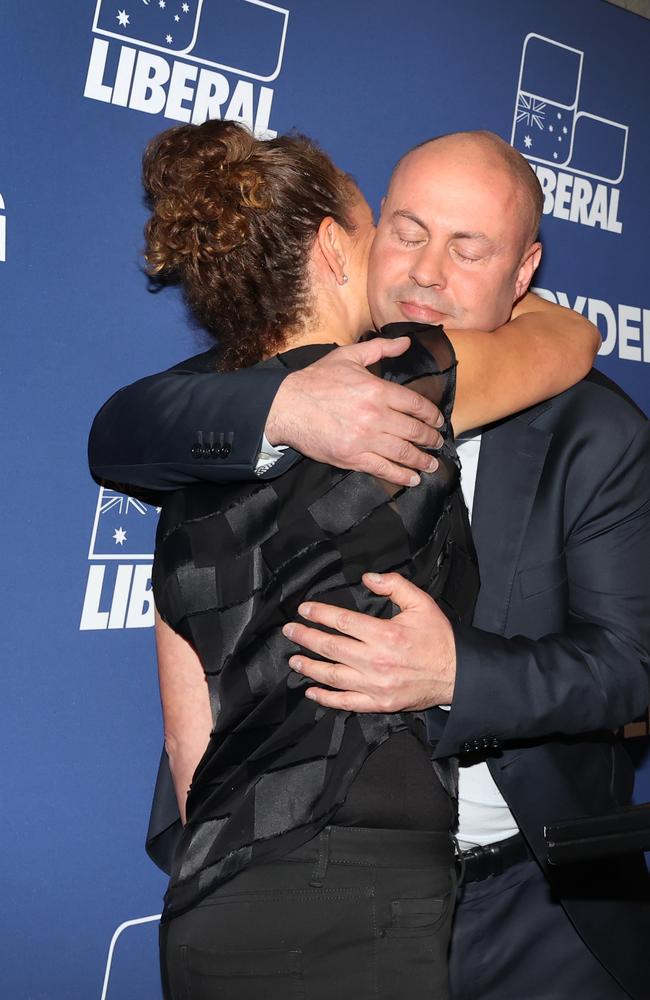 Josh Frydenberg is hugged by his wife Amie after his speech on election night. Picture: David Caird