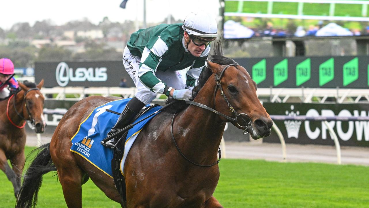 Growing Empire and Mark Zahra race away to win the Poseidon Stakes at Flemington. Picture: Vince Caligiuri/Getty Images