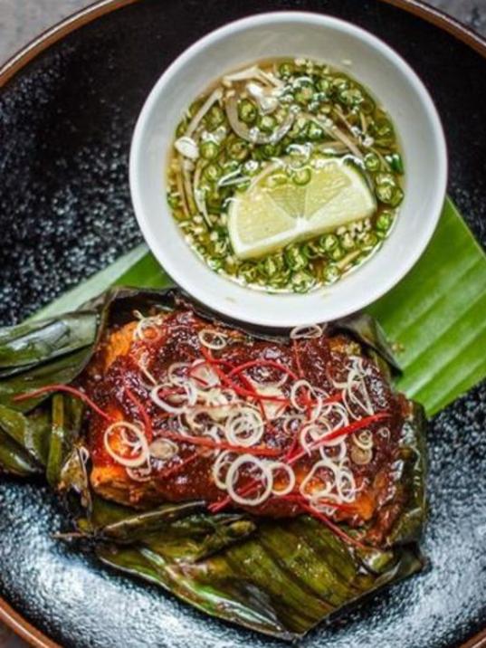 Char-grilled Ora king salmon wrapped in banana leaf, with aromatic red curry at Longrain. Picture: Instagram