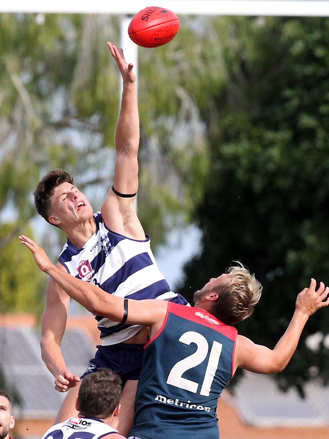 Round 6 QAFL game between Broadbeach and Surfers Paradise at Subaru Oval. Photo of Ryan Pickering gets some air in the ball up. 2 May 2021 Mermaid Waters Picture by Richard Gosling