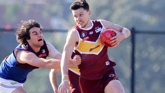 Sam Paterson slips clear of Adam Carafa. Picture: George Salpigtidis