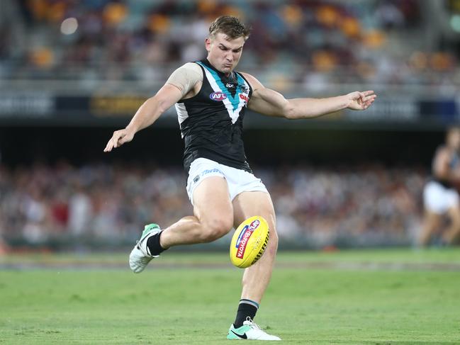 Ollie Wines of the Power kicks during the round three AFL match between the Brisbane Lions and the Port Adelaide Power at The Gabba. Picture: Chris Hyde/Getty Images