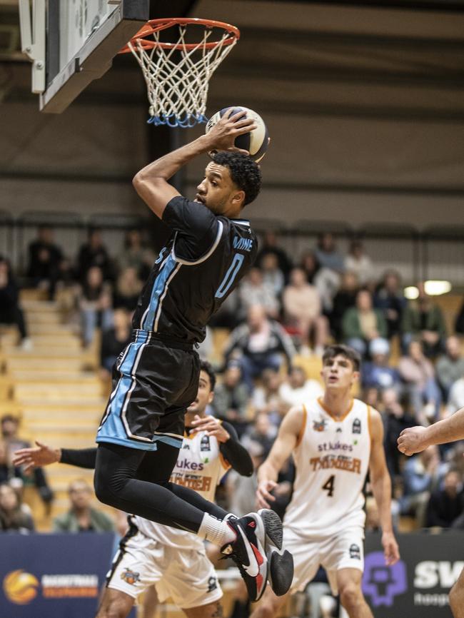 Jonathon Mines pulls down a rebound in the Chargers NBL1 season opener against North West Thunder. Picture: Eddie Safarik