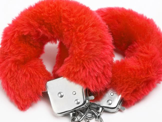 fluffy red handcuffs for story on Honey Birdette store selling sex toys in Westfield. Pic: ThinkStock