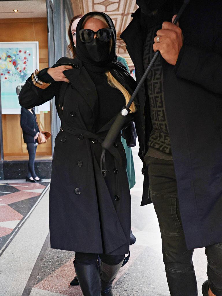 Her husband Belal Hamdan tried to block photographs after court hearing. Picture: Adam Yip