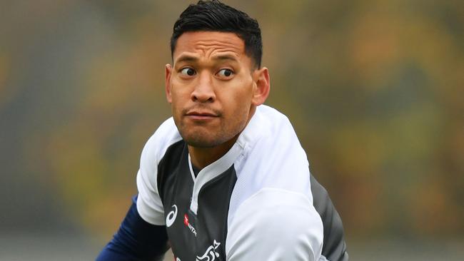 FILE: Israel Folau sacked by Rugby Australia for Homphobic tweet LONDON, ENGLAND - NOVEMBER 22: Israel Folau passes the ball during an Australia training session at The Lensbury Conference Centre on November 22, 2018 in London, England. (Photo by Dan Mullan/Getty Images)